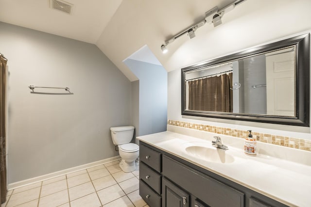 bathroom featuring tasteful backsplash, tile patterned flooring, visible vents, and vaulted ceiling