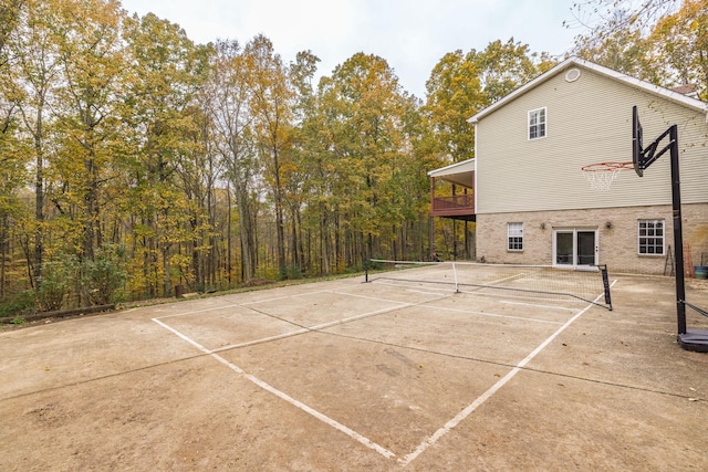 view of sport court with a tennis court