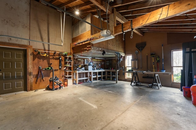 garage featuring a workshop area and a garage door opener