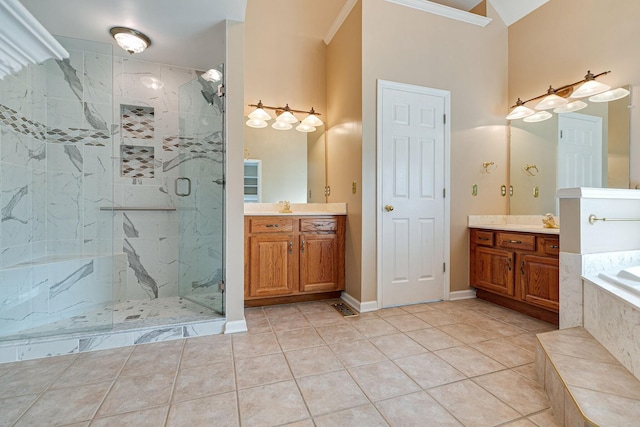 full bath featuring tile patterned flooring, two vanities, a marble finish shower, and a bath