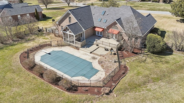 view of pool with a fenced in pool, a fenced backyard, a patio, and a lawn