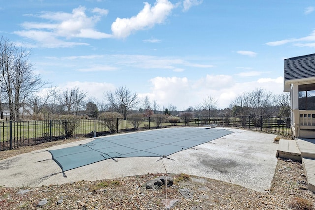 view of swimming pool with a patio area, fence, and a fenced in pool