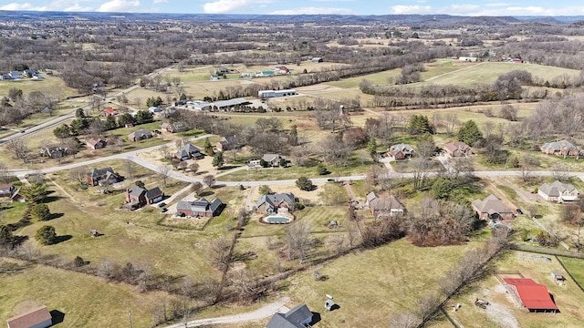 birds eye view of property with a rural view