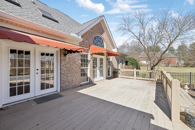 wooden deck featuring french doors