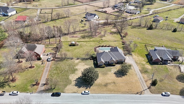 birds eye view of property with a rural view