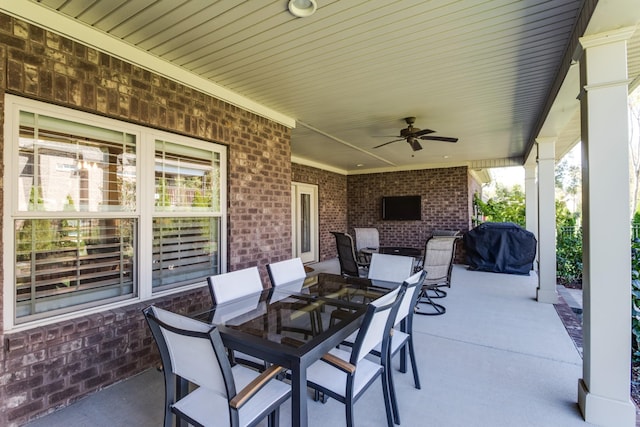 view of patio / terrace featuring outdoor dining space, grilling area, and a ceiling fan