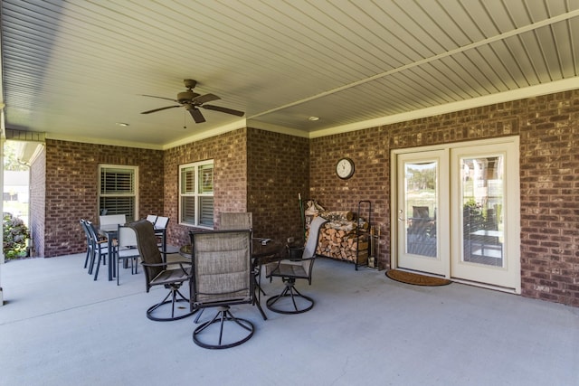 view of patio with outdoor dining area and ceiling fan