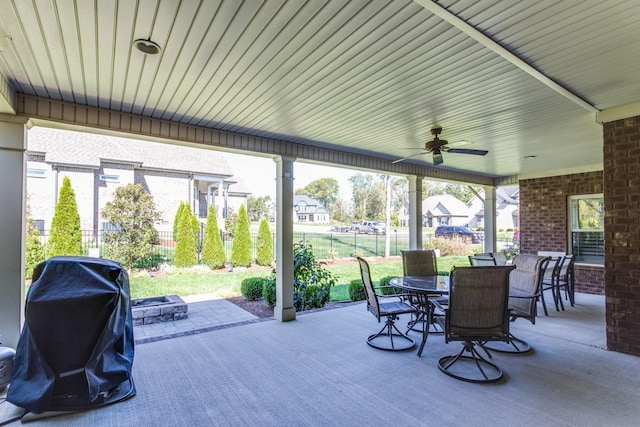 view of patio featuring ceiling fan, outdoor dining space, fence, and a grill