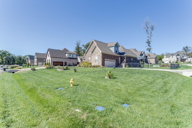 view of front of house with a residential view, fence, a front lawn, and brick siding