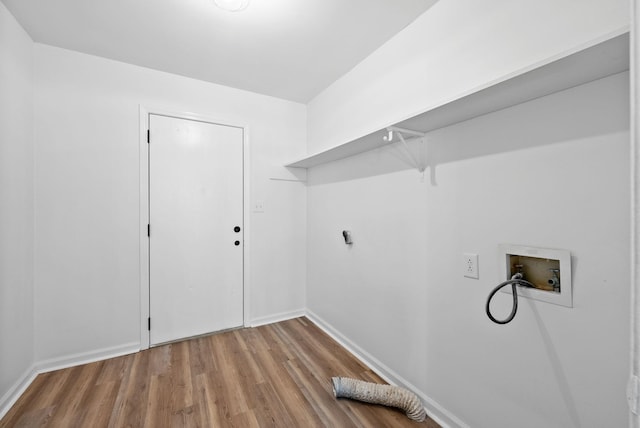 washroom featuring hookup for a washing machine, electric dryer hookup, wood finished floors, laundry area, and baseboards