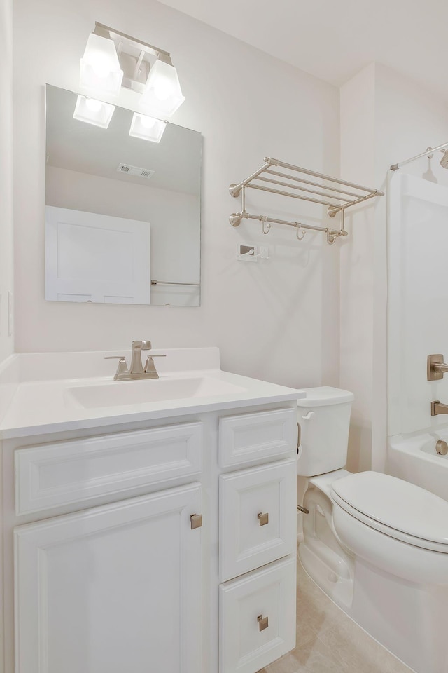 bathroom with toilet, tub / shower combination, vanity, and visible vents