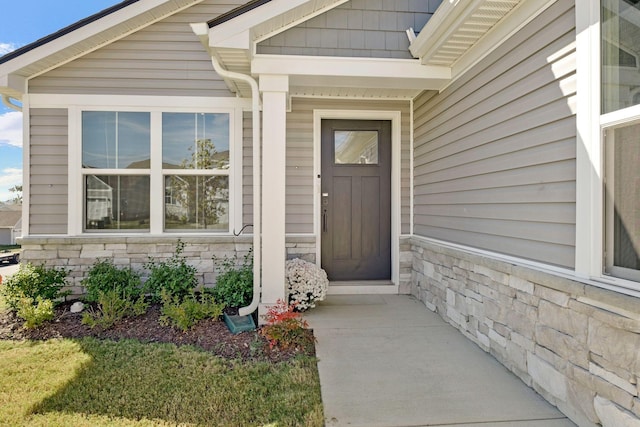 entrance to property with stone siding