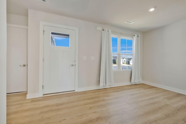 entrance foyer featuring baseboards, recessed lighting, visible vents, and light wood-style floors