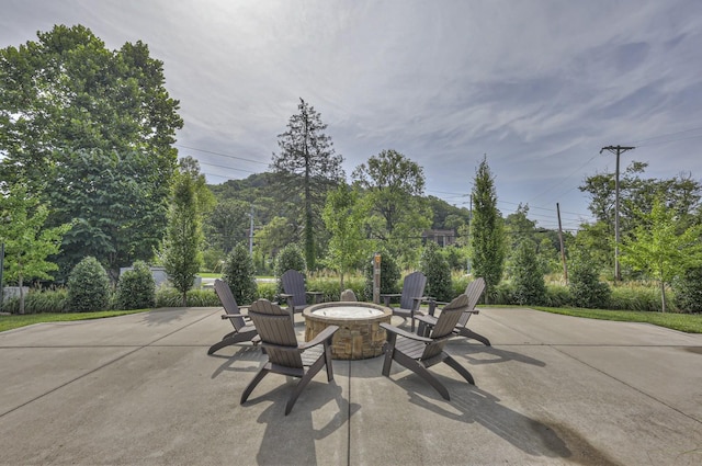 view of patio / terrace featuring an outdoor fire pit