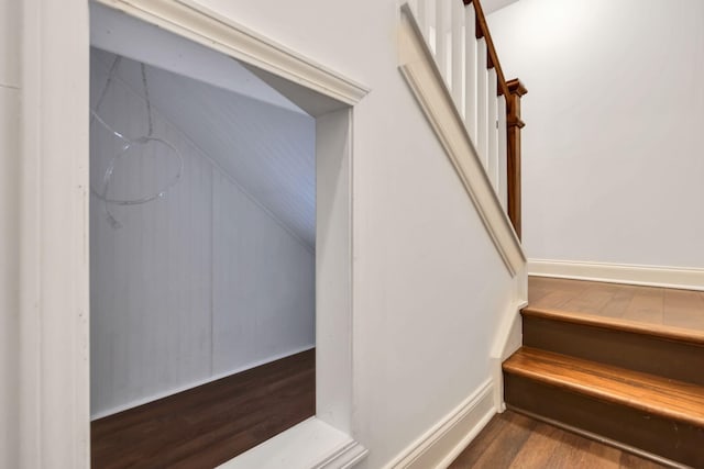 stairway with wood finished floors