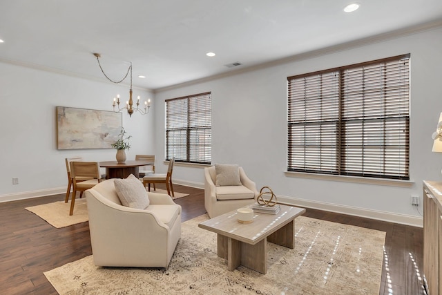 living room with baseboards, hardwood / wood-style floors, recessed lighting, and crown molding