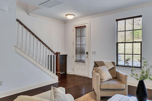 living room featuring visible vents, crown molding, stairway, and wood finished floors