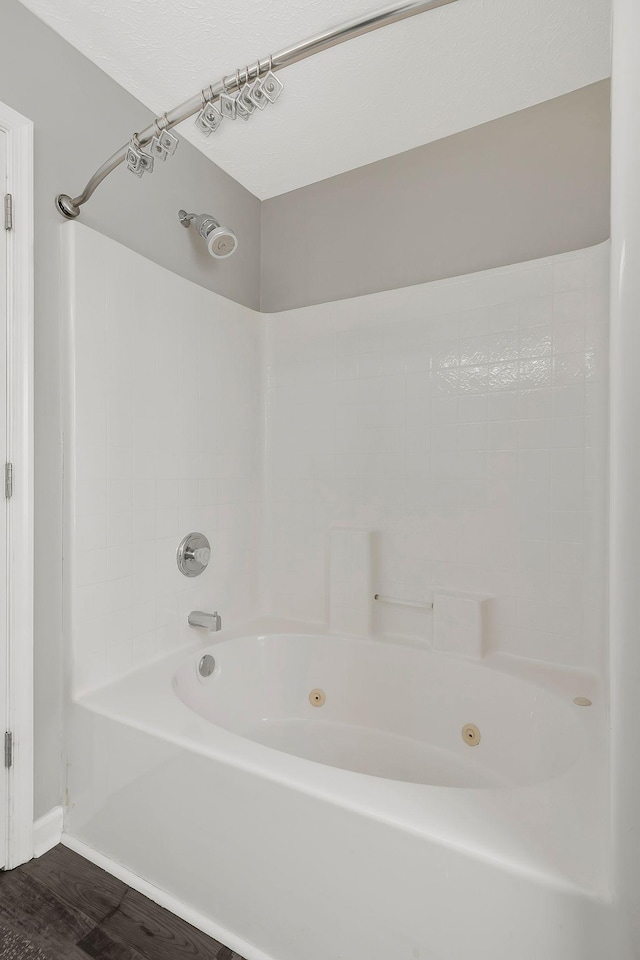 full bathroom featuring a combined bath / shower with jetted tub and wood finished floors