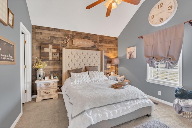 bedroom featuring wood walls, baseboards, and light colored carpet