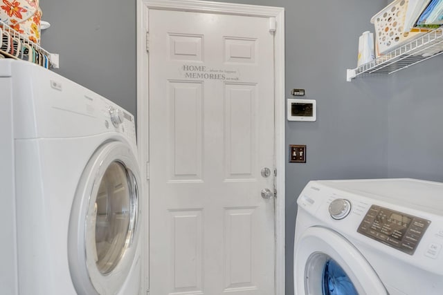 washroom with laundry area and independent washer and dryer