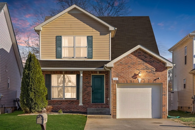 traditional home with a garage, brick siding, concrete driveway, a lawn, and roof with shingles