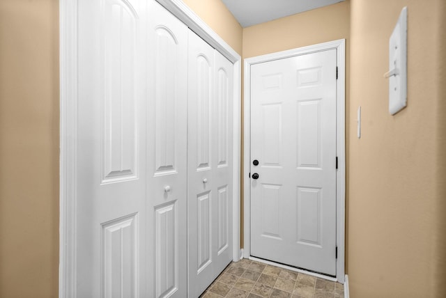 doorway featuring stone finish flooring