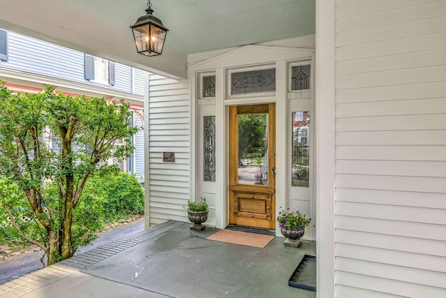 property entrance featuring a porch