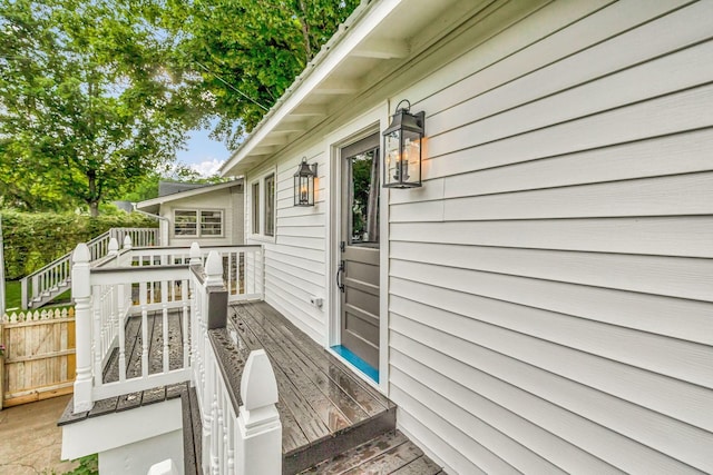 deck featuring fence and stairs