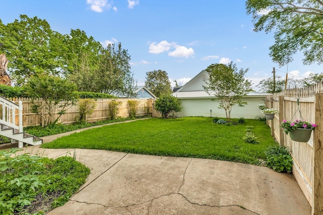 view of yard featuring a patio area and a fenced backyard