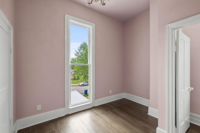 interior space featuring dark wood finished floors and baseboards