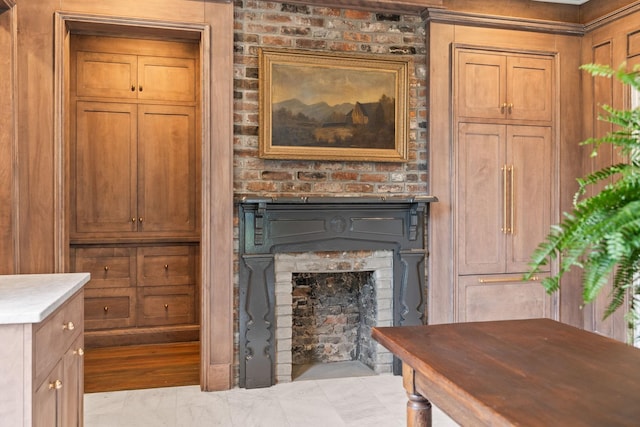 interior space with a brick fireplace