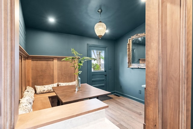 interior space with wood finished floors and baseboards