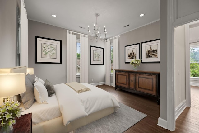 bedroom featuring recessed lighting, visible vents, baseboards, dark wood finished floors, and crown molding
