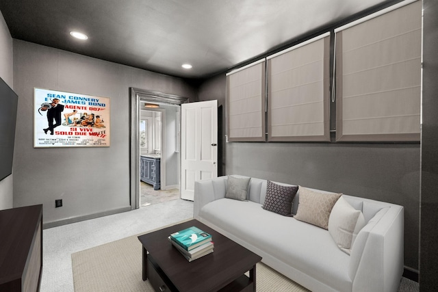 carpeted living room with baseboards and recessed lighting
