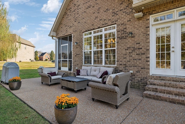 view of patio / terrace with french doors and an outdoor living space