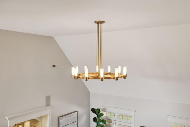 details featuring visible vents and an inviting chandelier