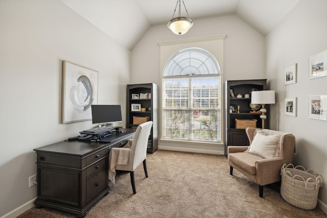 home office featuring lofted ceiling, carpet floors, and baseboards