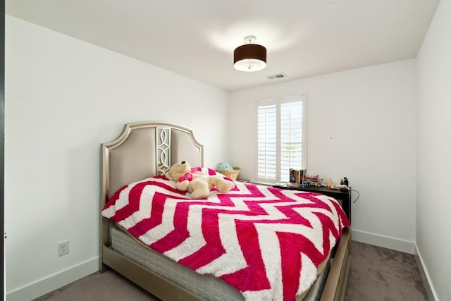 bedroom with carpet, visible vents, and baseboards