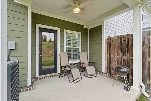 view of patio featuring fence, grilling area, and ceiling fan