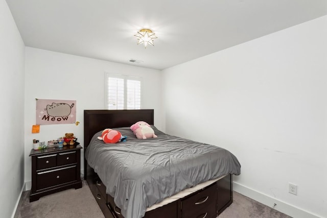 bedroom featuring visible vents, light carpet, and baseboards