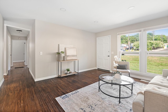 unfurnished living room featuring recessed lighting, visible vents, baseboards, and wood finished floors