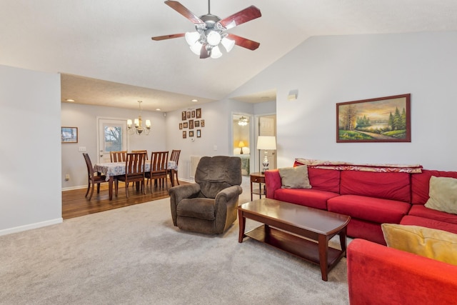 carpeted living room with recessed lighting, baseboards, vaulted ceiling, and ceiling fan with notable chandelier