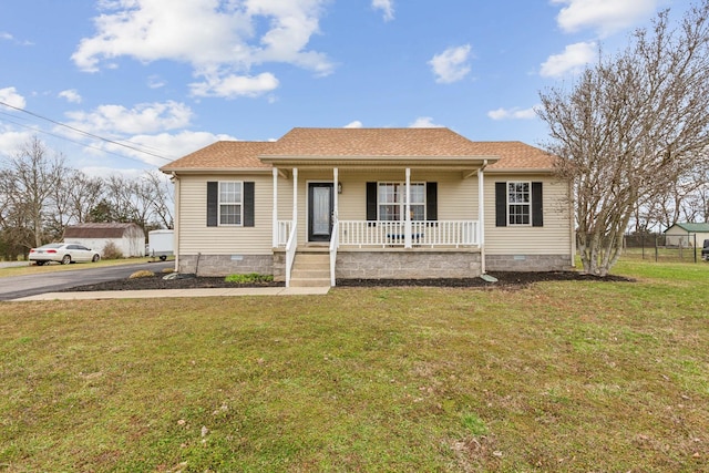 view of front of property with a shingled roof, a front lawn, covered porch, and crawl space