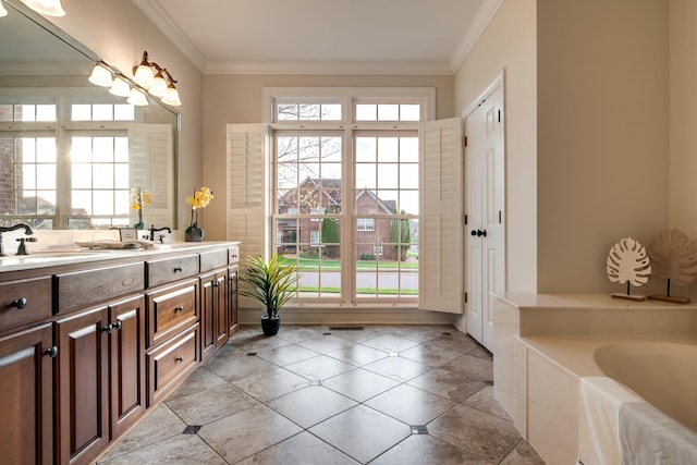 bathroom with crown molding, vanity, and a wealth of natural light