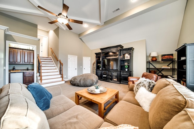 living area with indoor wet bar, light carpet, a ceiling fan, and lofted ceiling