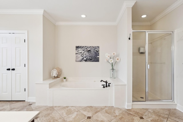 bathroom featuring crown molding, recessed lighting, a stall shower, and a garden tub