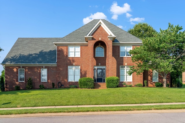 139 Thornwood Pl, Hendersonville, TN 37075 - colonial house featuring a front yard, brick siding, and roof with shingles
