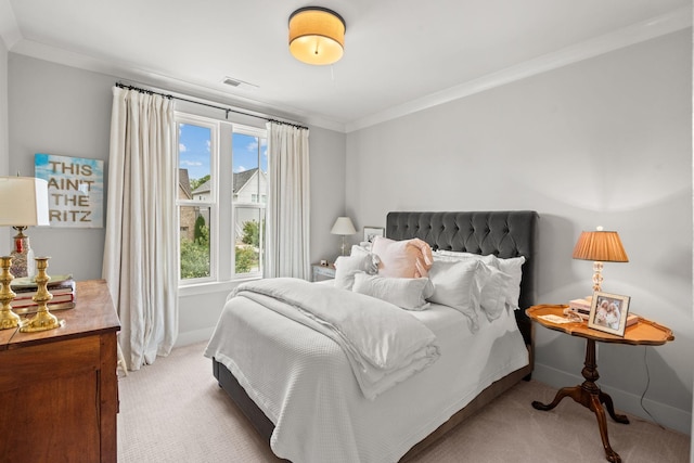 bedroom with ornamental molding, light colored carpet, visible vents, and baseboards