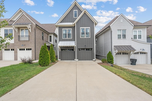 view of front facade with board and batten siding, driveway, and a garage