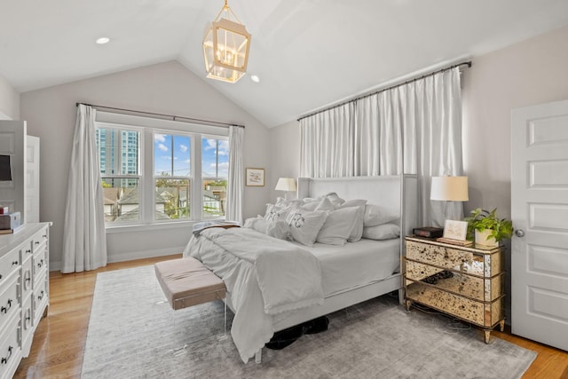 bedroom with light wood-type flooring, recessed lighting, and lofted ceiling